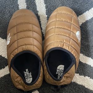 The NorthFace thermoball mules brown puffy down slippers.
